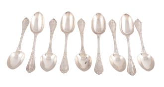 A set of nine Victorian silver dessert spoons by George Adams,   London 1858, engraved with