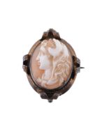 A shell cameo brooch,   carved with the profile of Hercules wearing the Nemean lion pelt, within a