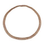 A gold coloured necklace,   composed of textured woven links, to a concealed box snap clasp,