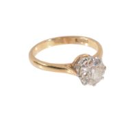An 18ct gold, platinum and solitaire diamond ring