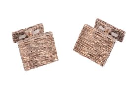 A pair of 9 carat gold cufflinks,   the rectangular textured panel with t bar fittings, stamped 375