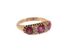 A 18ct gold ruby and diamond seven stone ring  , ring size L approx.