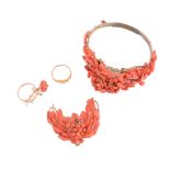 A coral bangle and brooch,   the bangle with various pieces of coral, on a gilt metal setting;