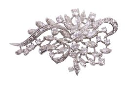A diamond leaf spray brooch  , circa 1970, the pierced abstract brooch set with brilliant and