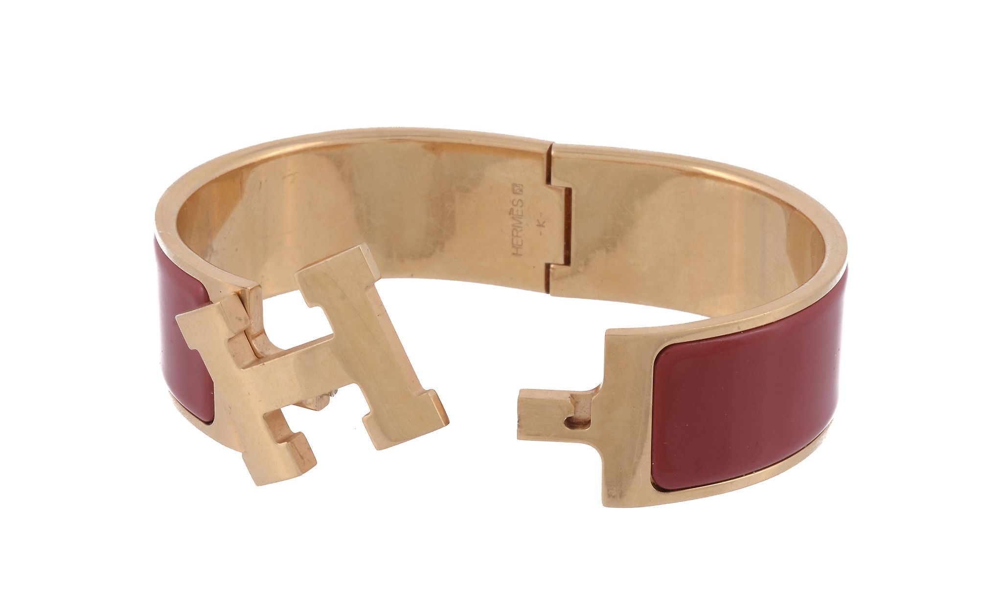 A Clic Clac hinged bangle by Hermes  , the two arms with red enamelled panels, to a central - Image 2 of 2