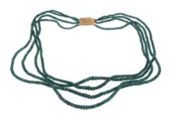 A facetted emerald bead necklace,   composed of four strands of facetted emerald beads, to a box