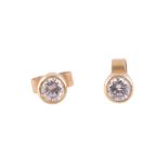 A pair of diamond ear studs,   the brilliant cut diamond in a collet setting, with post fittings,