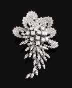 A diamond spray brooch,   the spray set throughout with brilliant cut, eight cut and baguette cut