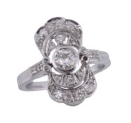 A diamond ring,   the central old brilliant cut diamond collet set within a pierced surround set