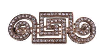 A diamond brooch,   of scrolling Greek key design set throughout with rose cut diamonds, 4.5cm long