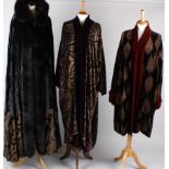 A full length black and gold silk velvet fur-trimmed hooded cloak by Gaggio, Italy; with a Charles