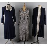 A 1940s navy blue wool crepe dress with a lace trimmed collar; together with a 1940s patterned crepe