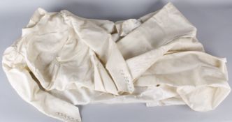 A 1930s full length long sleeved cream moiré taffeta wedding dress, with matching petticoat (