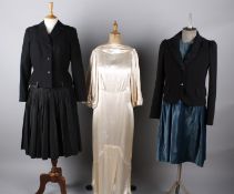 Eight items of early 20th century ladies costume, comprising: an ivory satin 1930s wedding dress,