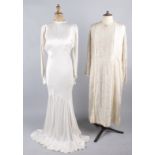 A 1920s oyster satin and lace wedding dress; together with a 1930s striped ivory wedding gown with