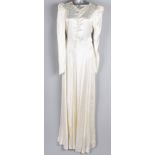 A collection of eight vintage wedding dresses, comprising: a 1940s white lace wedding gown, a