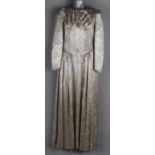 A 1970s Biba satin wedding coat; together with a 1940s cream wedding dress, a 1940s silver brocade