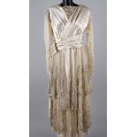 A 1920s wedding dress by Charles Lee & Son of Wigmore St. London, cream satin overlaid with a