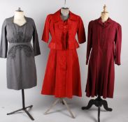 A collection of ladies costume, comprising: a black crepe 1930s dress, a 1940s maroon wool dress,