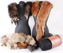 A collection of vintage fur items, including: fox fur stoles, fur muffs, a faux fur wrap and a