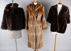 A 1940s fur cape; together with a 1950s fur coat, an Anne Jenkins mink hat, a rabbit fur jacket, a