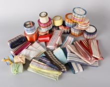 A large quantity of vintage ribbons, including: acetate checked and tartan examples, many on