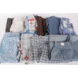 A selection of ladies vintage aprons, including: cotton and linen workwear aprons, nurses aprons and