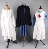 A collection of early to mid century nurses uniforms, workwear and domestic costume, including: a