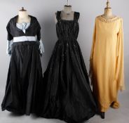 A 1950s Hartnell diamante pleated black ballgown; with an orange chiffon Hartnell gown, a dusky pink