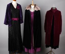 A 1930s black satin evening gown with black and cream cape to match; with a 1920s purple velvet
