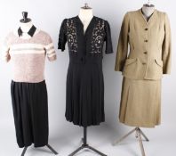 A 1930s lime green satin cowl neck dress; a 1940s black crepe dress, a tweed green and brown 1940s