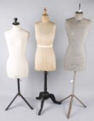 A Yugin & Sons female mannequin with a grey linen torso on a metal base; together with a 1920s