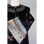 A late 19th/early 20th century Chinese silk embroidered coat with a turquoise lining, the coat is
