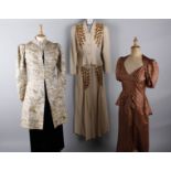 A 1930s fawn coloured evening dress and matching jacket with gold bead decoration; with a brown