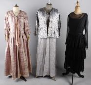 A group of eight items of evening wear, comprising: a 1940s black chiffon cocktail dress with