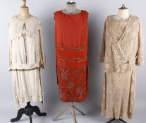 A 1920s silk lined Irish crochet dress and matching jacket; with a 1920s dark red beaded shift dress