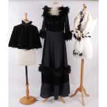 A black velvet and cotton layered evening dress trimmed with feathers; an ermine fur stole; a 19th