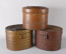 A 19th century tin hat box and two other similar hat boxes of a later date, (3).