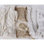 A collection of antique lace dress fragments, shawls and miscellaneous textiles; together with a