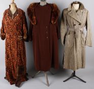 A full-length corded velvet brown and orange 1930s fur trimmed dress with integral cape; together