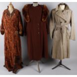 A full-length corded velvet brown and orange 1930s fur trimmed dress with integral cape; together