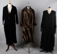 Six items of ladies costume circa 1920/30s, including: a black georgette and lace dress, a brown