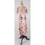 An early 1970s 100% silk short sleeved Pucci dress, vibrant geometric design made up of pinks,