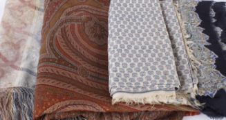 A large 19th century Paisley shawl (with some damage), a cream shawl with a pink and blue woven