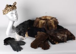 A quantity of vintage fur garments, including: a fur muff with fox head to the front, several