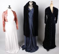 A 1930s Harrods pale grey silk evening dress; with a 1920s black velvet coat, a 1930s red and gold