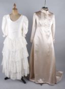 Six vintage wedding dresses, comprising: a cream 1960s wedding dress, a 1960s brocade wedding dress,