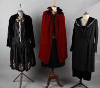 Six items of ladies costume circa 1920/30s, including: a black brocade coat with a fur collar, a