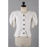 A Jean Muir Studio white quilt-effect single breasted jacket, with short sleeves gathered at the