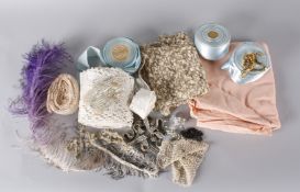 A collection of textiles, trimming and lace, including: unused 1930s peach silk lingerie fabric, a